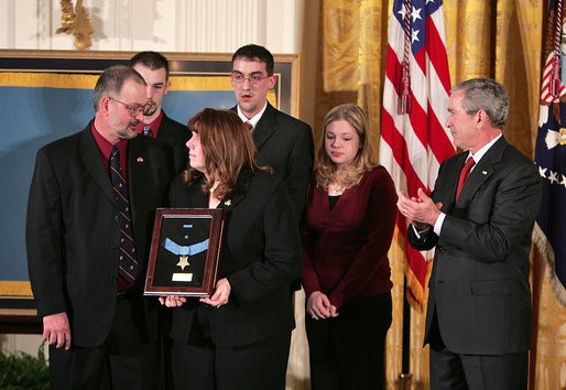 President George W. Bush presents the Medal of Honor to the family of Corporal Jason L. Dunham, U.S. Marine Corps, during a ceremony at the White House