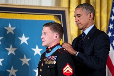 Kyle Carpenter receiving the Medal of Honor from President Barack Obama during a ceremony at the White House