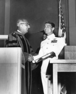 CSM President Julio Bortolazzo honors Lt. Dieter Dengler at 1967 Commencement. SMCCD Historical Photo Archive